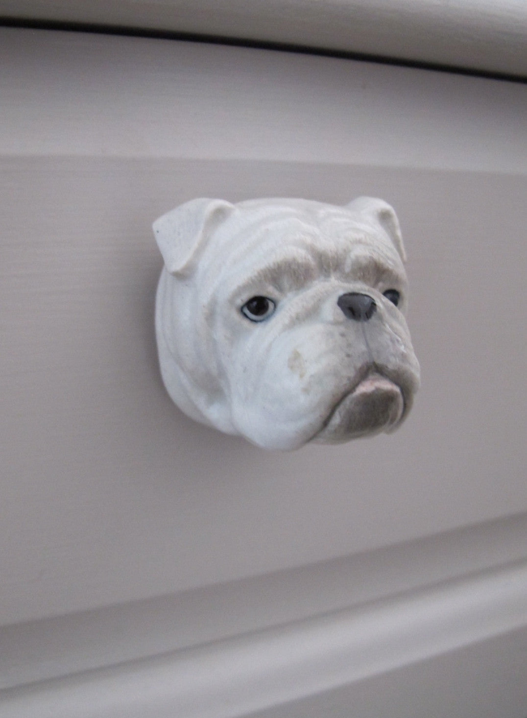 Poignée de porte tête de bouledogue